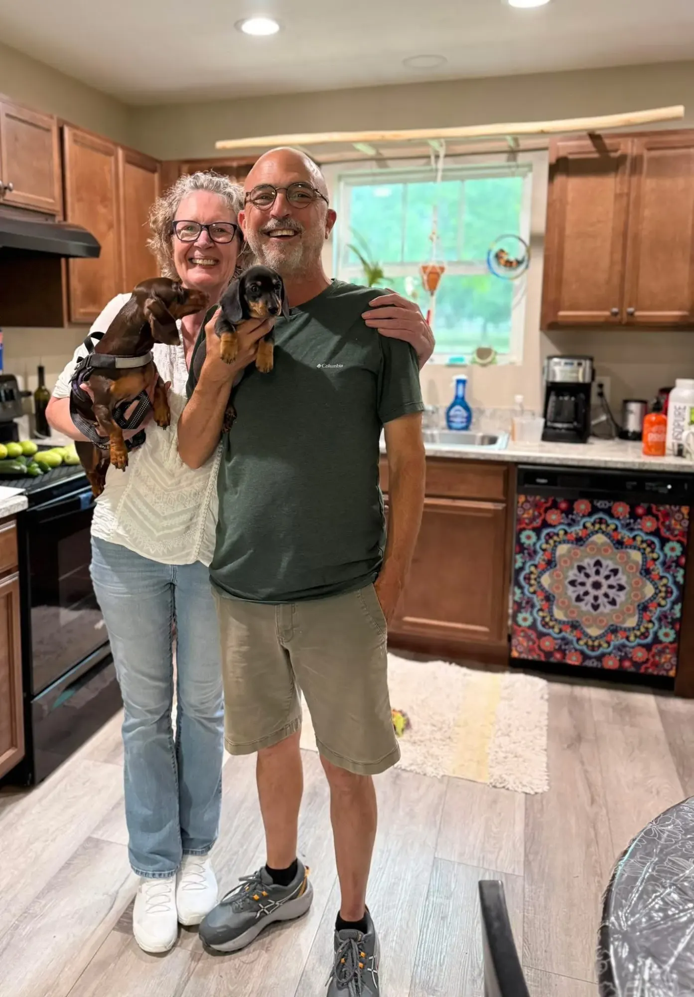 A family picking up their Miniature Dachshund puppy at Irish Rose Acres