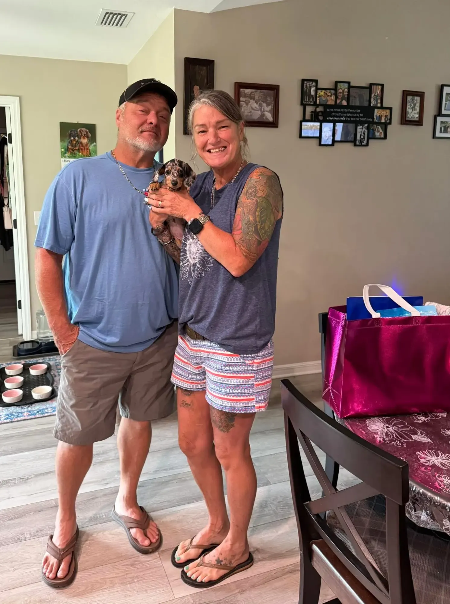 A family picking up their Miniature Dachshund puppy at Irish Rose Acres