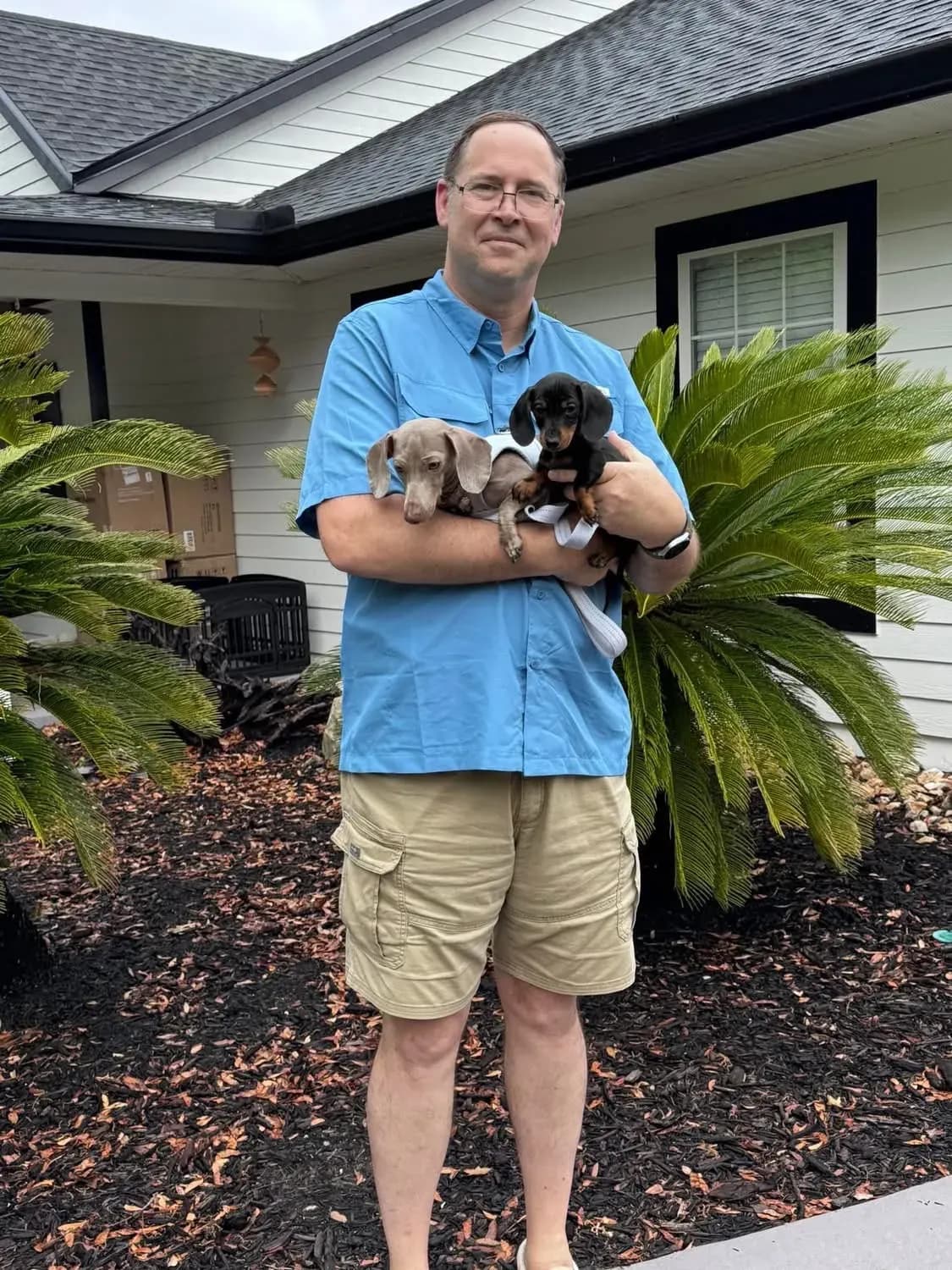A family picking up their Miniature Dachshund puppy at Irish Rose Acres