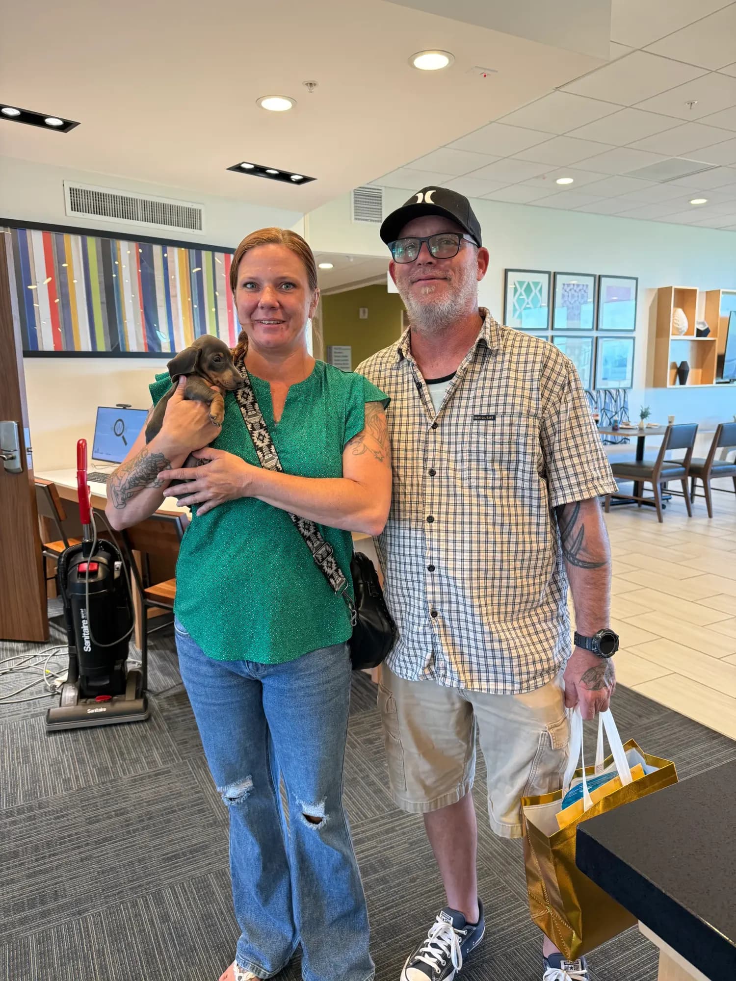 A family picking up their Miniature Dachshund puppy at Irish Rose Acres